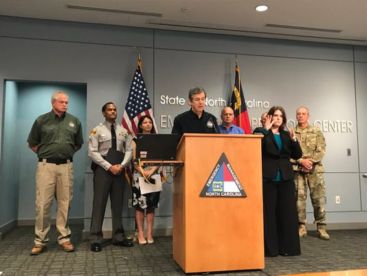 North Carolina Gov. Roy Cooper gives an update on the state's preparations for Hurricane Florence in Sept. 2018. Photo by Sam DeGrave/Asheville Citizen-Times.